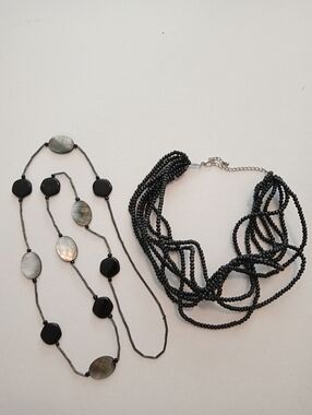 #1187.  2 Piece, Shell & Black Acrylic Multi Strand Necklace Bundle